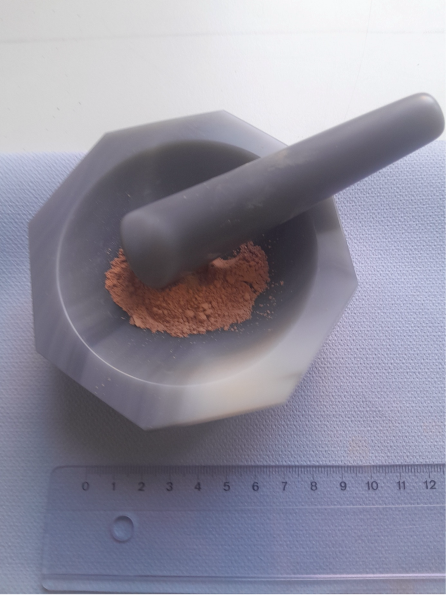 Prepared powder sample for XRD inside of an agate mortar.